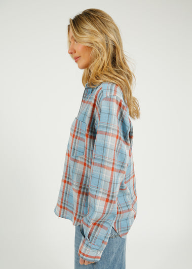 PARK Classic Shirt in Blue Plaid Woman wearing a plaid shirt with a plain background